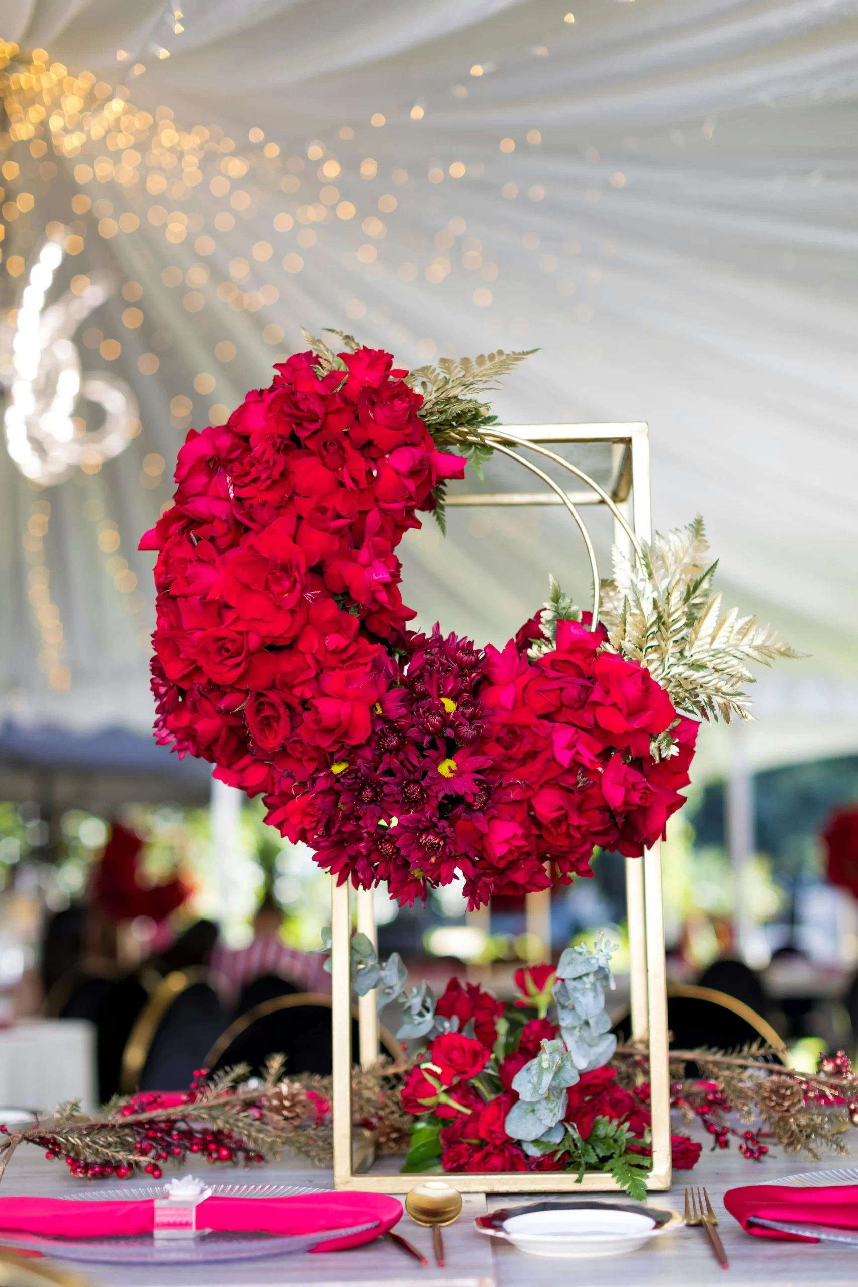 a red flowers on a stand